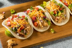 Homemade,Shredded,Chicken,Tacos,With,Lettuce,Cheese,Tomatoes
